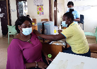 Janet Tulasi Mensah taking her jab