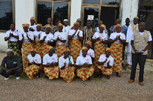 A group photo of the Upper East Region Women Wing of the GRCS with some dignitaries.