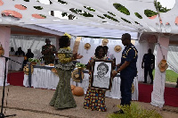 Frederick Mwenvil Dibkuu presents artwork to Chief of Staff