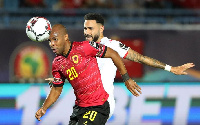 Angola's Eduardo is being battled for the ball