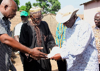 Minister (in cowboy hat) met with some farmers