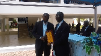 Dr Daniel McKorley (L) receiving his citation from Prof. Manu