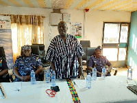 Colonel Kwadwo Damoah (Rtd), in smock, addressing officers and NABCO trainees at Paga