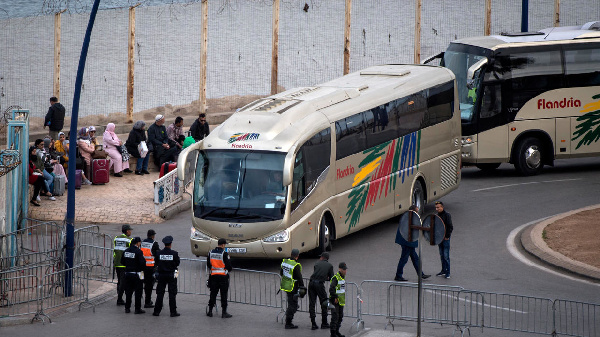 Passengers wait in their cars as they were refused entry at the Tanger Med port in the northern city