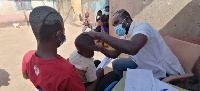 A child undergoing an ear screening