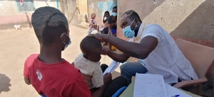 A child undergoing an ear screening