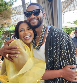 Berla Mundi hugs Usher