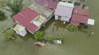 Some homes submerged in the floods after the dam spillage in early October