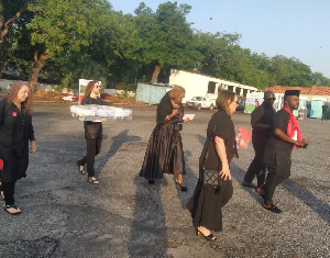 Akosua Puni Essien (in the middle holding an envelope) arrives for Christian Atsu's burial