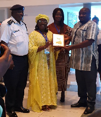 May Obiri-Yeboah receiving her award from Panda David Panda Noah of Sierra Leone