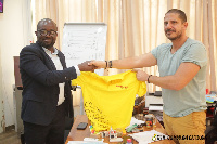 GFA President presents a jersey to an Ashfoam official