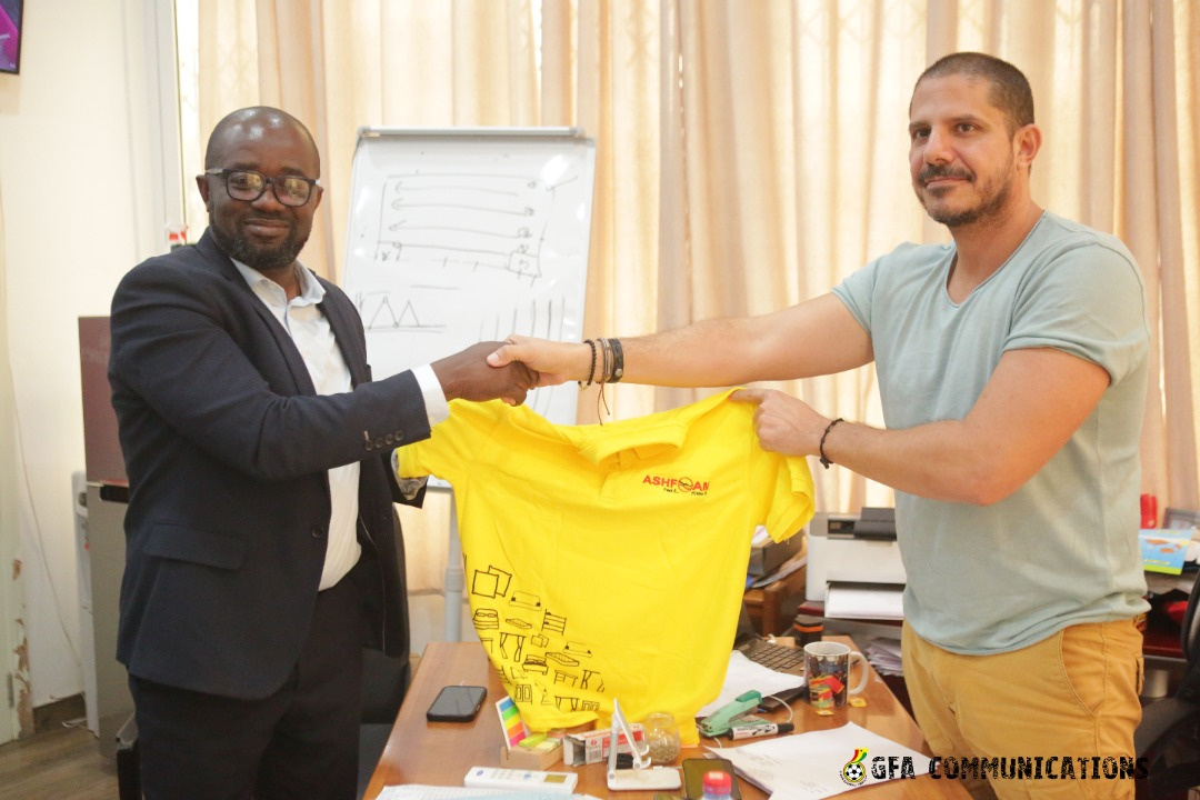 GFA President presents a jersey to an Ashfoam official