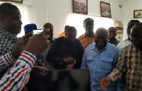 Freddie Blay taking delivery of the equipment from Chairman Sugri with Nana Addo and others