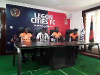 Bashir Hayford flanked by three of his players