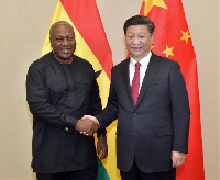 President Mahama in a handshake with President Xi