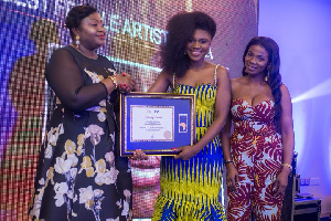 Becca receives her award at the African Prestigious Awards