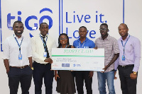 Staff of Tigo Insurance making the presentation