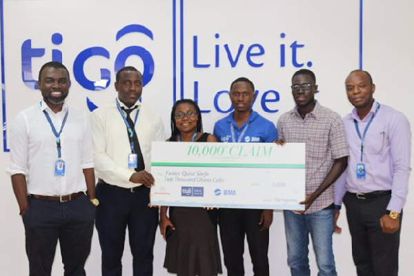 Staff of Tigo Insurance making the presentation