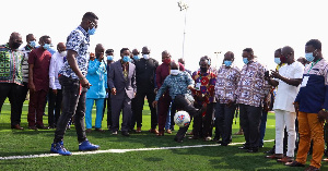 Asamoah Gyan playing football with President Akufo-Addo