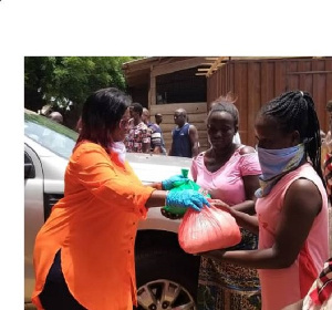 Maame Efua Sakyi-Aidoo, Deputy National Women Organizer, NDC presenting relief items