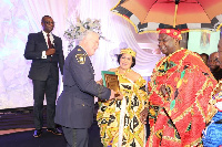 The Montrealhene adorned in a colourful kente cloth during a ceremony