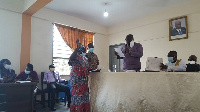 Madam Comfort Asante being sworn into office by the Regional Minister