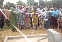 Residents cut ribbon at the project site.