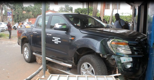 The car dragged the woman into a gutter before finally entering a shop.