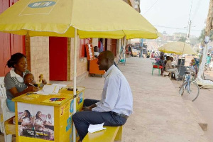 A MoMo merchant serving a client