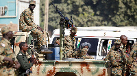 Burundi soldiers stand guard during a patrol.