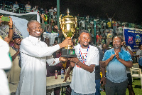 Sports Minister, Mustapha Ussif handing over the trophy to the winners