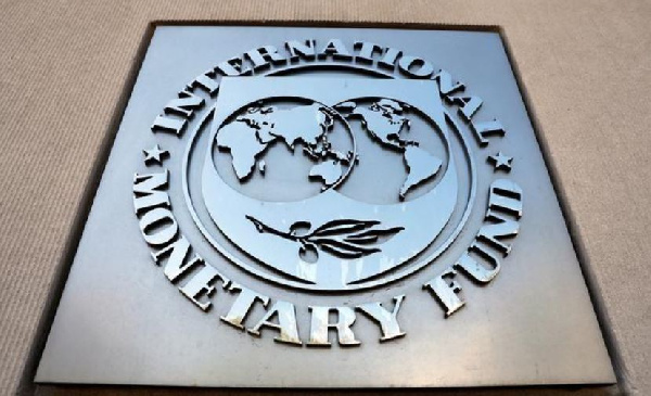 International Monetary Fund (IMF) logo is seen outside the headquarters building in U.S