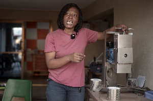 Deborah Opandoh standing by her invention