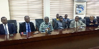 Dr. Anthony Nsiah-Asare (middle) addressing the media