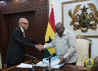 Justice Emile Short presenting the commission's report to President Akufo-Addo