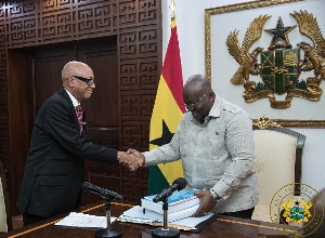 Justice Emile Short presenting the commission's report to President Akufo-Addo