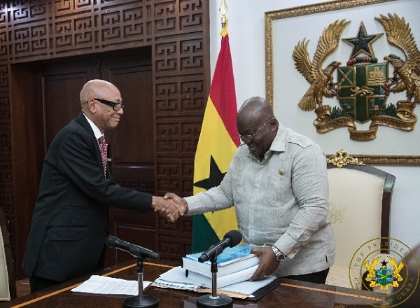 Justice Emile Short presenting the commission's report to President Akufo-Addo