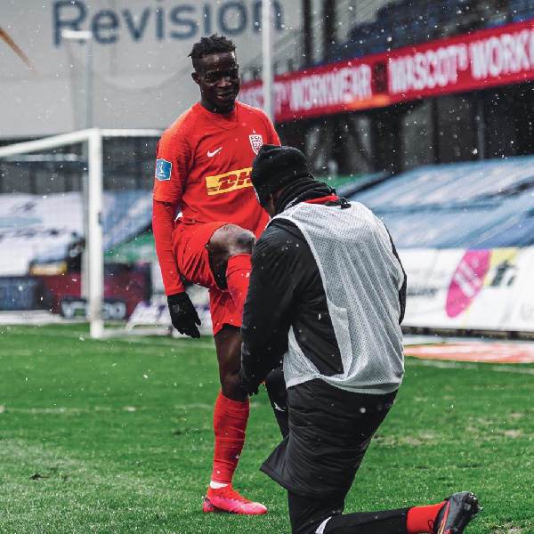 Kamal Deen Sulemana in a red jersey