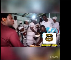 The Pastor was seen sitting and sharing the Fufu and cow meat himself