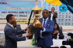 Emmanuel Kofi Nti, General Commissioner of GRA with the trophy