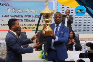 Emmanuel Kofi Nti, General Commissioner of GRA with the trophy