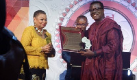 Dr Mensa Otabil presenting an award