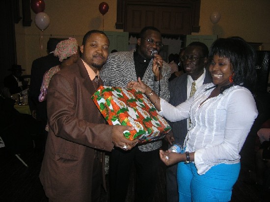 Mr. CNN, Patrick Gyan, Ata Amoyaw present the first prize raffle winner to Sister Margaret