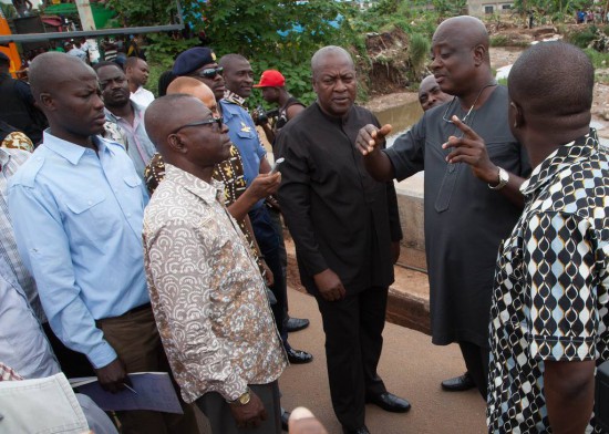 President Mahama inspecting the flood area with MCE and other officials