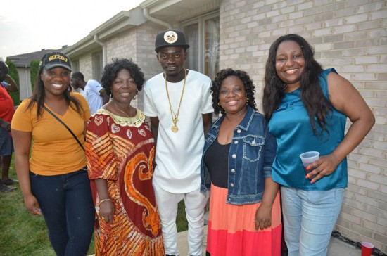 Lilwin poses with some patrons at the event