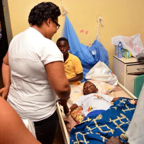 Vivian Jill chats with sick child on admission