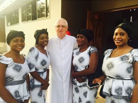 the Anamoah's family with the priest