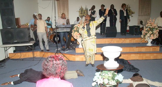 Anointed and powerful singer turned the mood to worship and people
became overcomed with the holy spirit and lied down. WOW