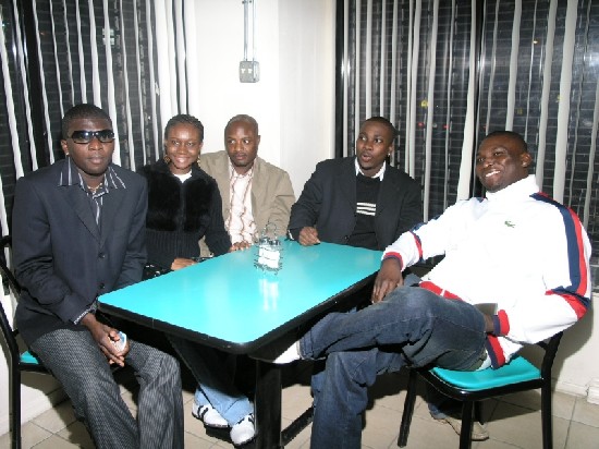 MC Extraordinaire, Abraham Kwadwo Lincoln, aka Papa Linc or Lincoln, famed Hiplife artist, Nana Caesar of Annuanom (second from right) and friends relaxing and getting ready to be served