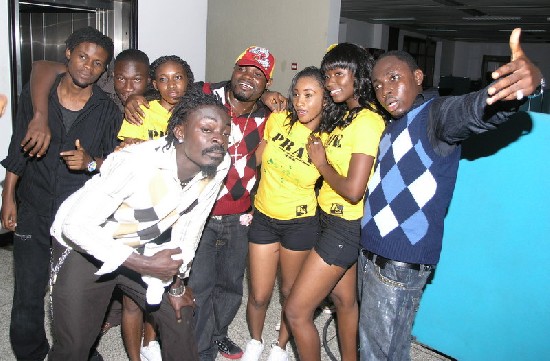 Praye and dancers posed backstage